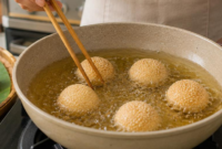 Onde-onde tradisional tetap digemari masyarakat Indonesia. Simak cara membuat onde-onde agar tidak pecah saat digoreng.( Poto : AI ).