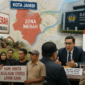 DJKN Kemenkeu Dijadwalkan Kunjungi Jambi, Warga Siapkan Dialog Soal Zona Merah.( Ilustrasi Poto : AI )