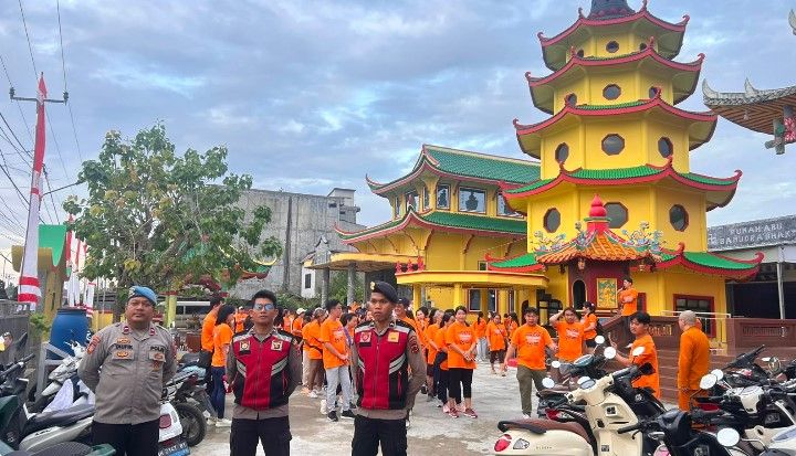 Polsek Tungkal Ilir amankan jalan santai Waisak di Vihara Budhayana Kuala Tungkal, Kecamatan Tungkal Ilir, Kabupaten Tanjung Jabung Barat, Minggu (7/6/2026) pagi.( poto : jambiprima.com )