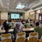 Pemaparan perkembangan program dalam kegiatan diseminasi dan pemutaran film di Kantor Bappeda Litbang Kabupaten Tebo, Kamis (25/6/2026).( poto : jambione.com )