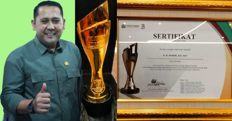 Bupati Merangin H. M. Syukur saat menerima penghargaan Pemred Award dan Pena Emas 2026 sebagai Bupati Terbaik Bidang Komunikasi dan Informasi.(poto: jambiprima.com)