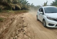 Perbaikan jalan Kabupaten Merangin di Desa Rasau dan Selango disambut gembira warga.(poto: meranginkab.go.id).