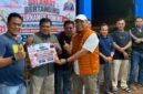 Sekretaris Daerah Merangin Zulhifni bersama pasangannya Deni Auriza sukses mengamankan gelar juara pertama pada Turnamen Domino HUT RI ke-81.(poto: seriusnews.id).