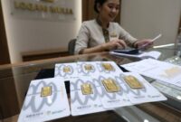 Daftar harga emas Antam di butik Logam Mulia turun menjadi Rp2.561.000 per gram pada Kamis (15/10/2026).(Ilustrasi poto: AI).