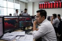 Ilustrasi: Suasana tegang di bursa saham saat IHSG anjlok ke level 5.907 pada sesi perdagangan pagi ini, Kamis (15/10/2026).(poto: AI).